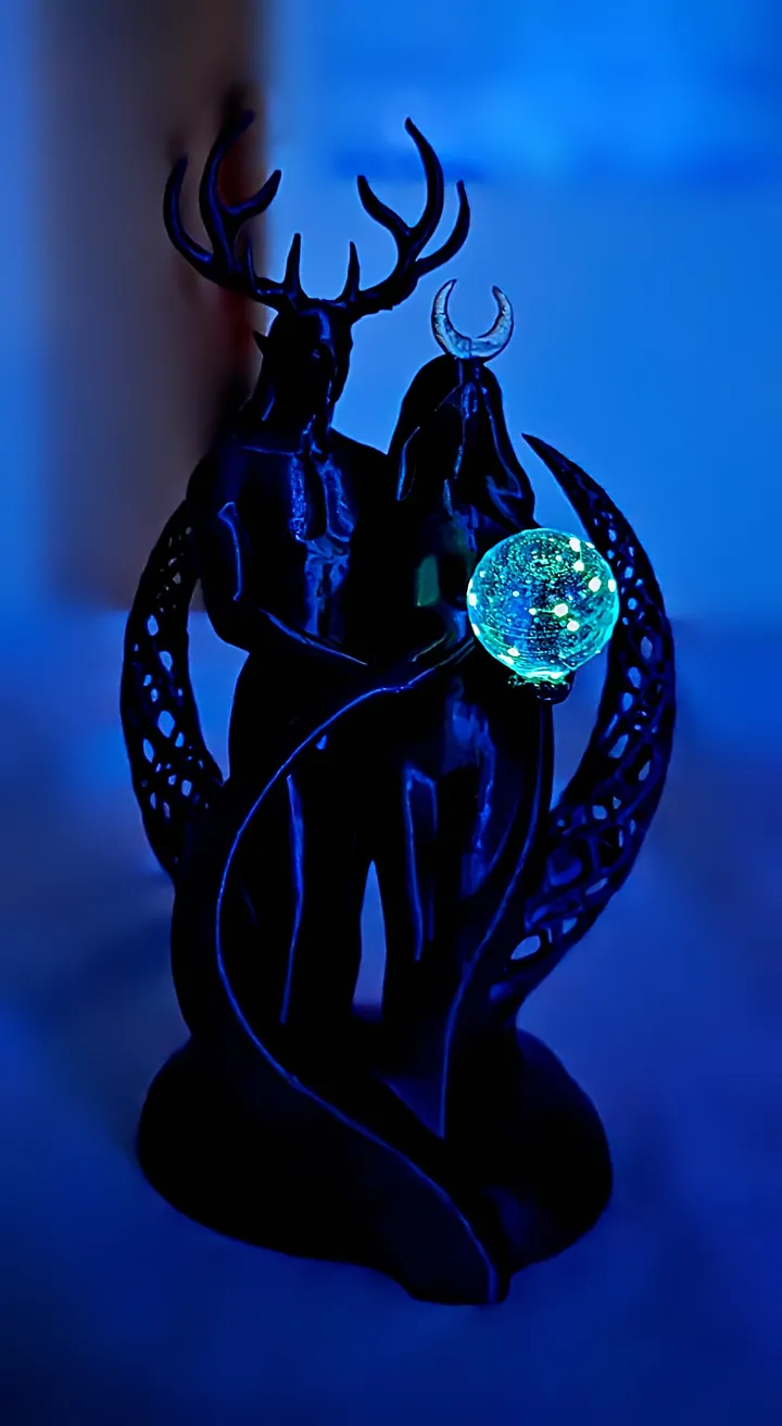 Held Light, black, lit orb. 3D printed by Foolish Form.